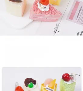 Detailed view of realistic artificial mousse cake model with strawberry and cherry toppings