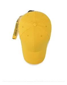 Top view of yellow cotton baseball cap featuring long trend streamers with black lettering