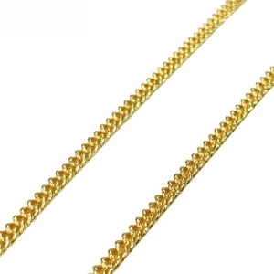Macro detail of 18k gold-plated curb chain with glossy finish and durable links