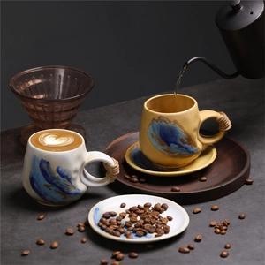 Detail of pouring coffee into a marbled ceramic mug with a twine-wrapped handle