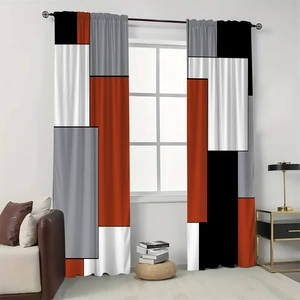 Close-up of geometric color block curtains in black, white, grey and burnt orange tones