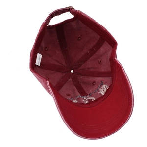 Inside view of burgundy washed cotton baseball cap with adjustable buckle and stitch detail