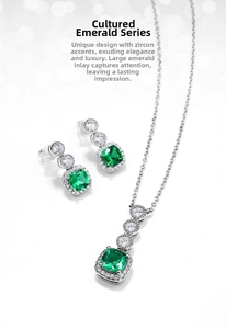 Close-up of vintage emerald necklace and earring set in 925 silver with cubic zirconia
