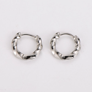 Detailed view of twisted silver stainless steel hoop earrings with snap closure