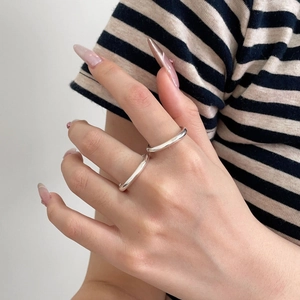 S925 sterling silver minimalist rings on model hand with polished finish design