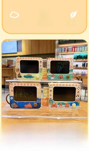Detailed view of four mini Capybara magnetic drawing board keychains in various colors
