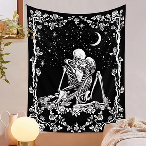 Detail of bohemian skull and rose tapestry hanging above a bed in a cozy bedroom