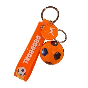 Orange football keychain with goal weave strap and soccer player silhouette pendant
