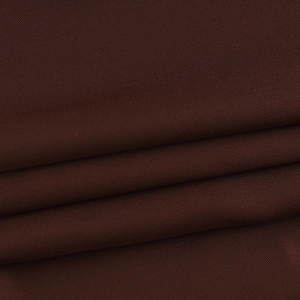 Macro du tissu de haut en dentelle marron foncé montrant la texture et le drapé