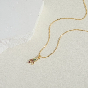 French vintage 14K gold plated necklace with a colorful zircon rocket shell pendant