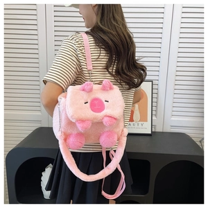 Detail of pink plush alpaca backpack showing soft faux fur texture and shoulder strap