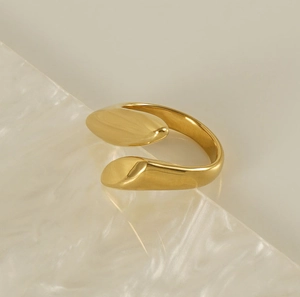 Macro shot of polished 18k gold plated stainless steel open ring with smooth edges