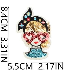 Detailed sequin embroidery patch of a girl's face with 8.4cm by 5.5cm size indicators