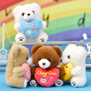 Group of colorful mini plush teddy bears holding hearts, cute bag charm keychains
