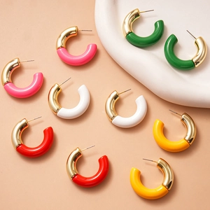 Five pairs of C-shaped hoop earrings featuring gold metal and colorful acrylic splicing
