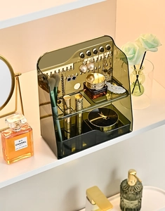 Close-up of transparent green PET organizer with jewelry hooks and storage drawers