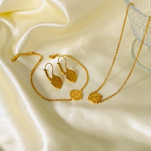 French vintage stainless steel gold jewelry set with evil eye coin pendants on silk