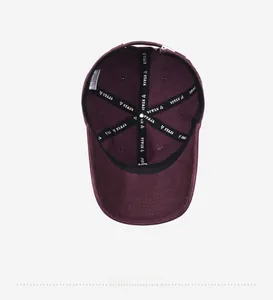 Detail view of cotton baseball cap interior featuring NY&JA branded inner taping and seams