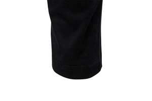 Macro detail of high-quality double stitching on a black cotton knit long sleeve T-shirt