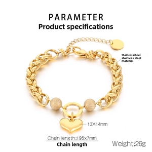 Detailed view of golden heart pendant on chunky stainless steel chain with measurements