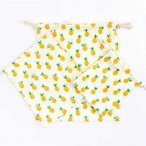 Three-piece set of cotton linen drawstring storage bags with yellow pineapple prints