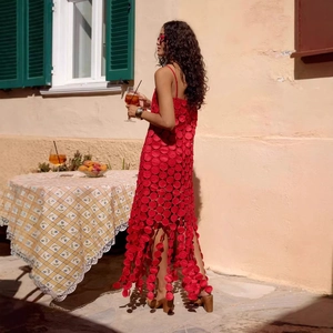 Elegant red hollow-out polka dot midi dress with tassels for a Mediterranean vacation look
