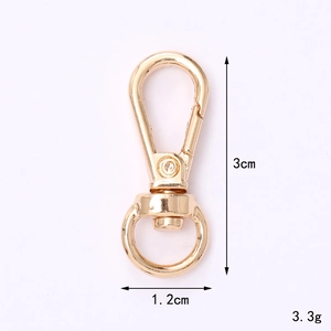 Detail of a 3cm golden zinc alloy lobster clasp with dimension and weight markings