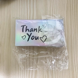 Close-up of holographic Thank You cards for small business in transparent packaging