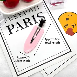 Detailed view of pink 6cm hair clip with matte finish and silver metal duckbill base