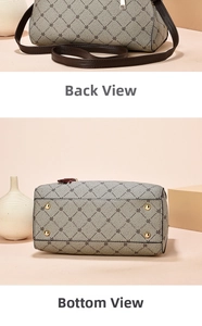 Detail view of the gray textured bag bottom featuring four protective gold metal rivets