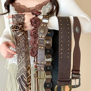 Vintage western brown studded belts with floral accents and leopard print scarf for dresses