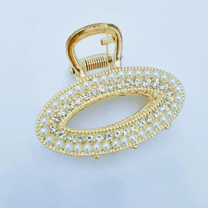 Eleganter Haarklammer aus Goldmetall mit Perlen und Strasssteinen in ovalem Design