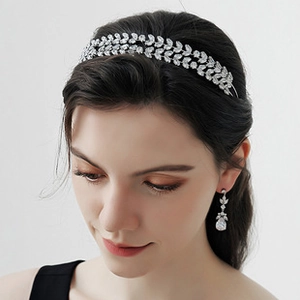 Close-up of bridal leaf headband and matching teardrop earrings with silver plating
