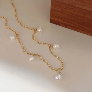 Minimalist 925 silver gold chain necklace featuring five irregular baroque pearls