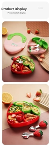 Detail of strawberry baby feeding set with silicone bib, divided suction plate and utensils