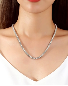 Close-up of S925 sterling silver moissanite tennis necklace worn on a model neck