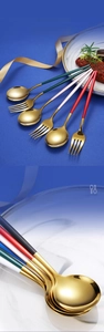 Detail of high-gloss gold-plated spoon head with colored matte handle on marble
