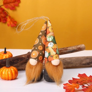 Fall themed plush gnome ornaments with maple leaves and pumpkins for festive decor