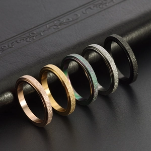Set of 5 minimalist frosted rotating stainless steel rings in various metallic finishes