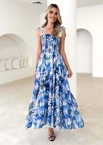 Detail of tiered floral maxi dress with smocked bodice and lace-trim tie straps