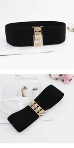 Detail of wide black elastic waist belt with a textured gold oval interlocking buckle