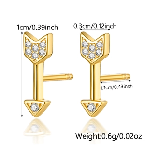 Macro view of gold-plated arrow stud earrings with clear crystals and product dimensions