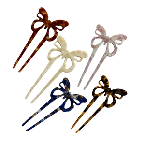 Modern butterfly acetate hair pins in five marbled colors with U-shaped minimalist design