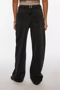 Detail of washed black wide-leg jeans featuring adjustable back waist buckle and pockets