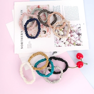Set of 10 small 22 momme mulberry silk hair scrunchies in various pastel colors