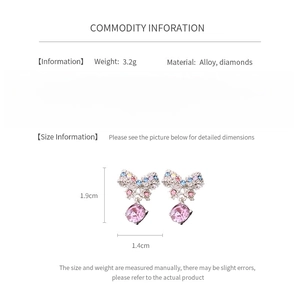 Detailed view of colorful bow earrings with pink gemstone drop and product dimensions