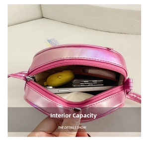 Detail view of pink iridescent unicorn crossbody bag showing spacious interior capacity