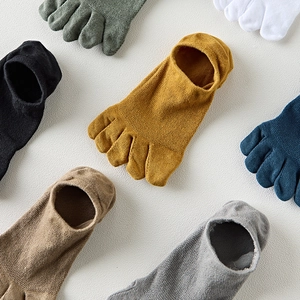 Flat lay of colorful men's five-finger toe socks in breathable knit cotton