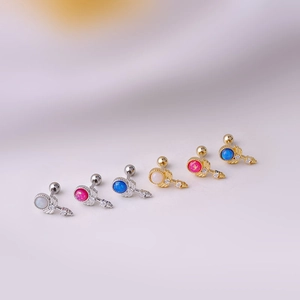Detail of 0.8mm titanium steel helix studs with colorful opal stones and zircon wings