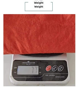Detail showing Christmas tree skirt weight measurement on a scale at seventy-seven grams